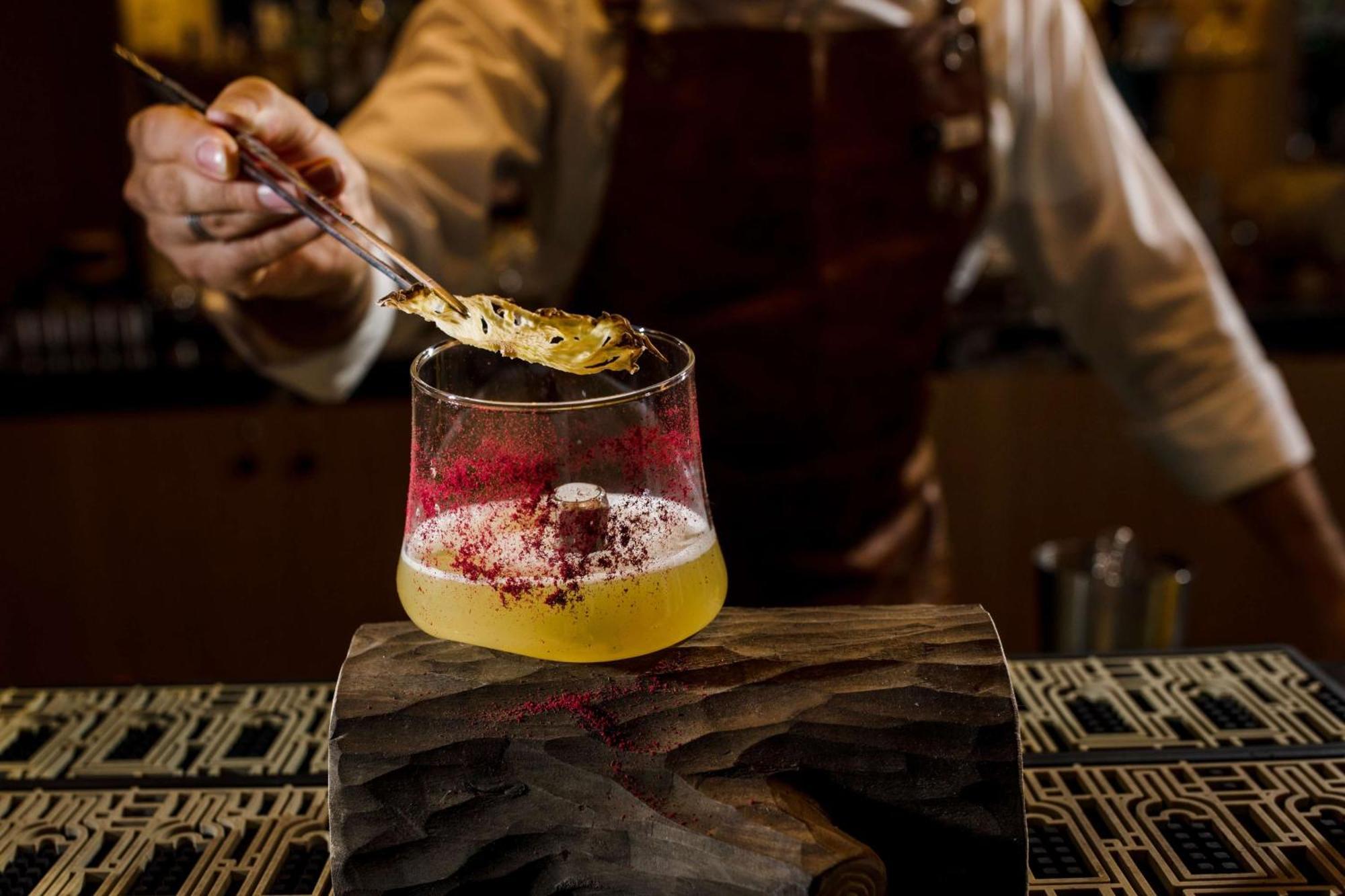 Rixos Premium Dubrovnik Hotel Bagian luar foto A bartender adding a gold leaf to a cocktail