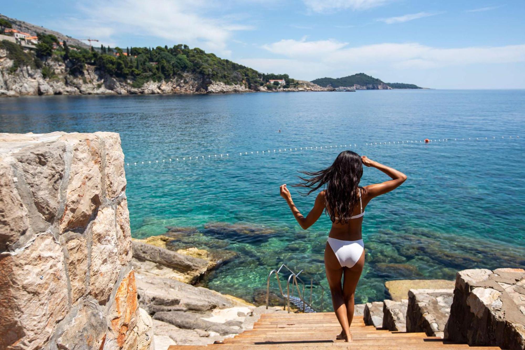 Rixos Premium Dubrovnik Hotel Bagian luar foto A woman in a bikini